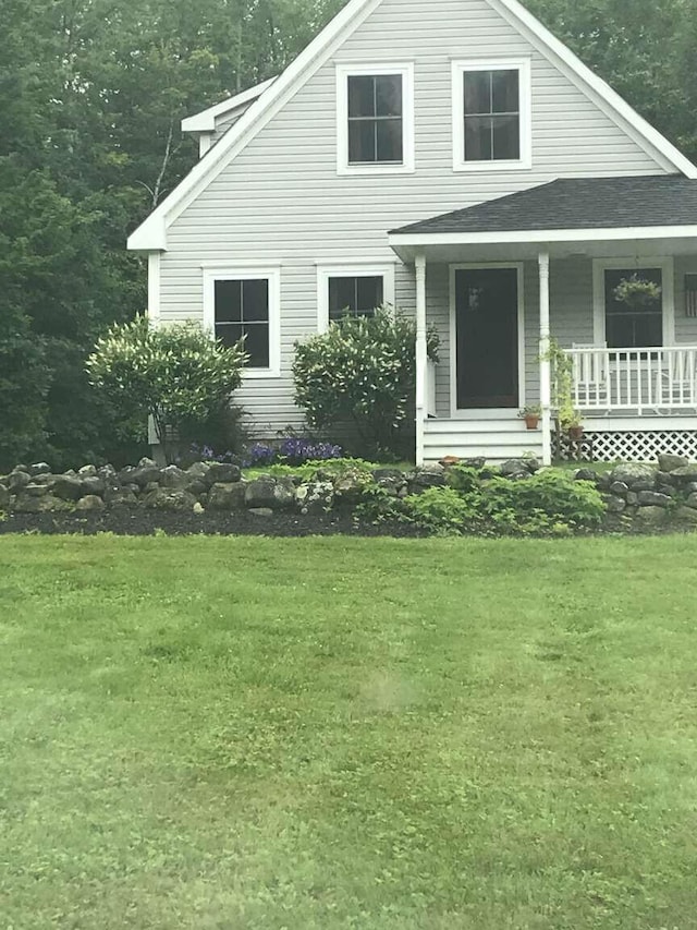 281 Danville Corner Rd, Auburn, ME 04210 - view of front facade featuring a shingled roof, a porch, and a front yard