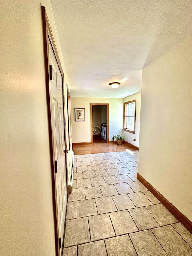 281 Danville Corner Rd, Auburn, ME 04210 - corridor with baseboards, a textured ceiling, and light tile patterned floors