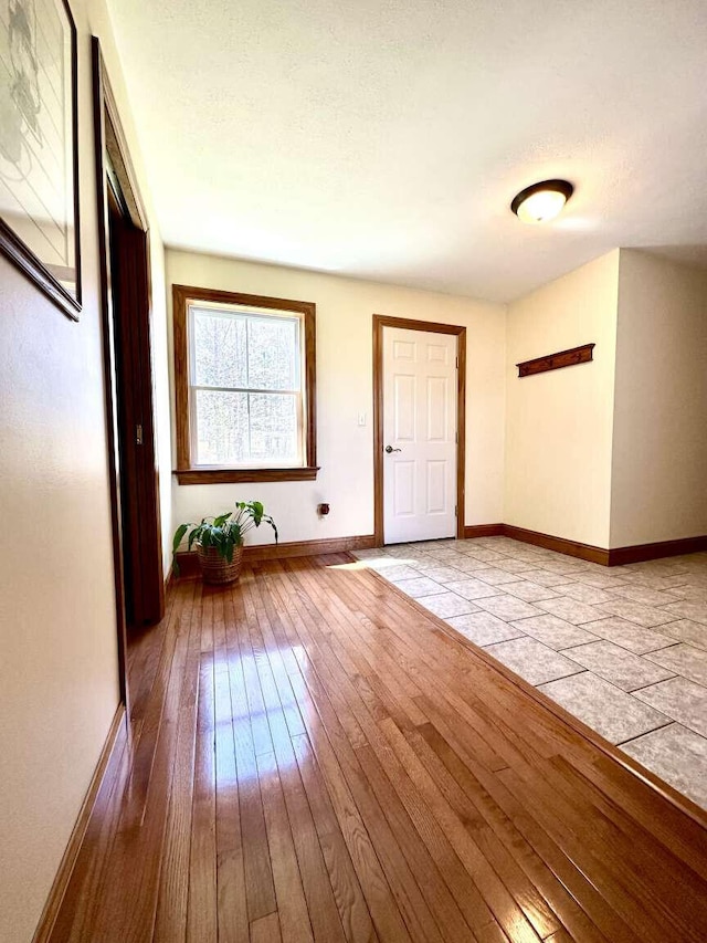 281 Danville Corner Rd, Auburn, ME 04210 - foyer entrance featuring baseboards and wood-type flooring