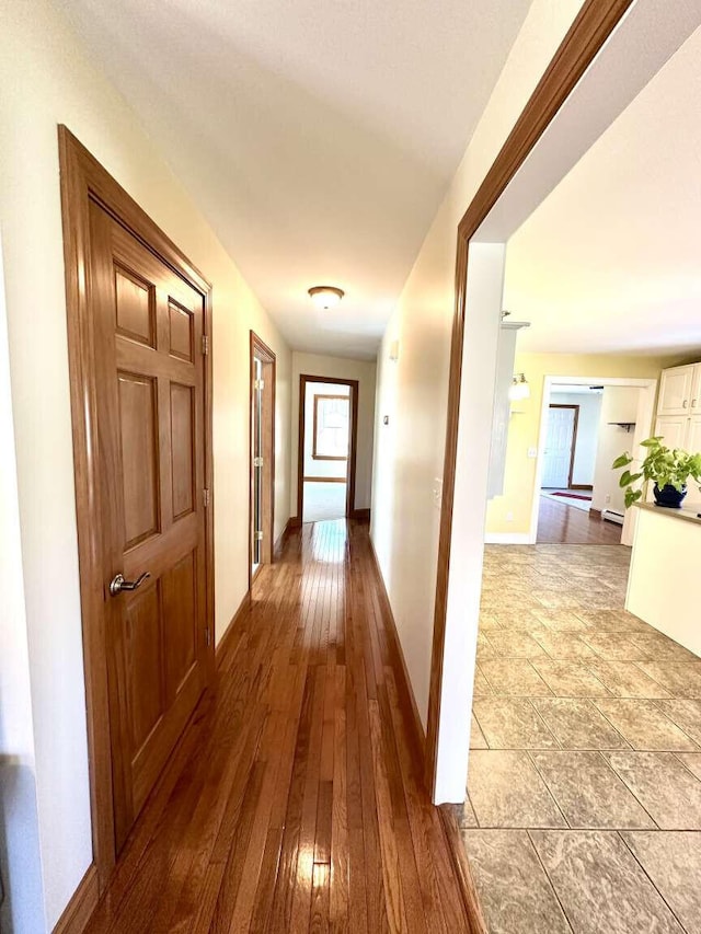281 Danville Corner Rd, Auburn, ME 04210 - corridor featuring baseboards and hardwood / wood-style floors