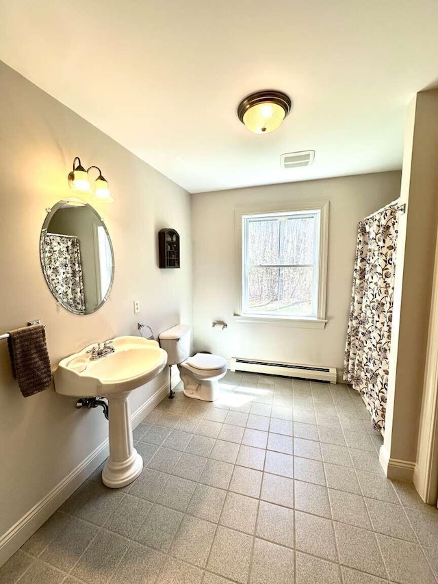 281 Danville Corner Rd, Auburn, ME 04210 - full bath featuring toilet, baseboards, visible vents, and a baseboard radiator
