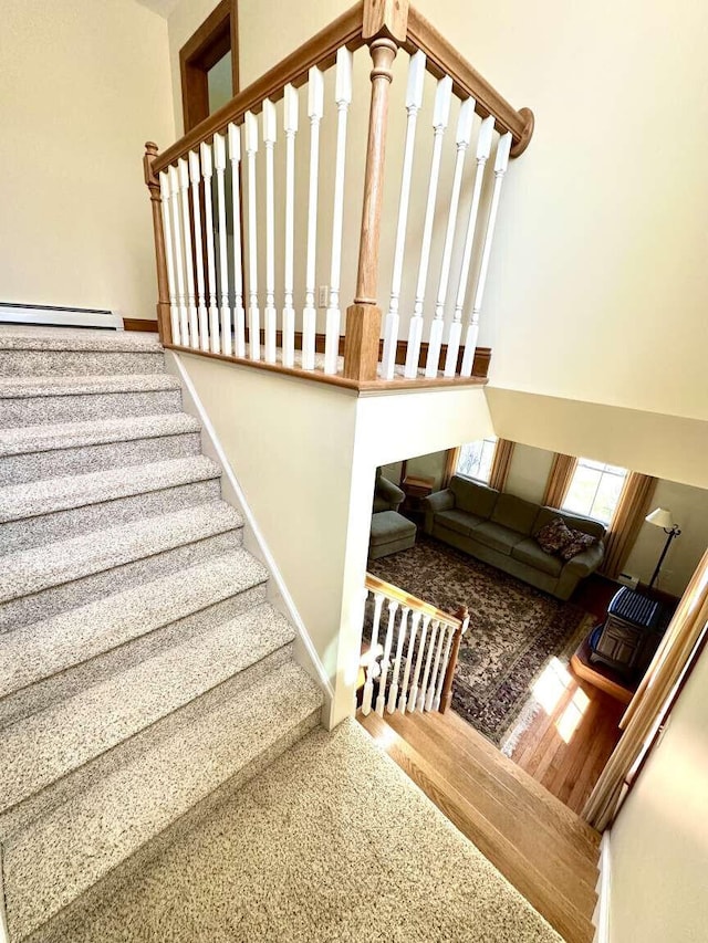 281 Danville Corner Rd, Auburn, ME 04210 - stairway with baseboards, a baseboard radiator, and carpet floors