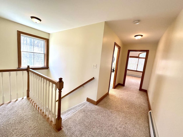 281 Danville Corner Rd, Auburn, ME 04210 - hallway featuring baseboards, a baseboard radiator, light carpet, and an upstairs landing