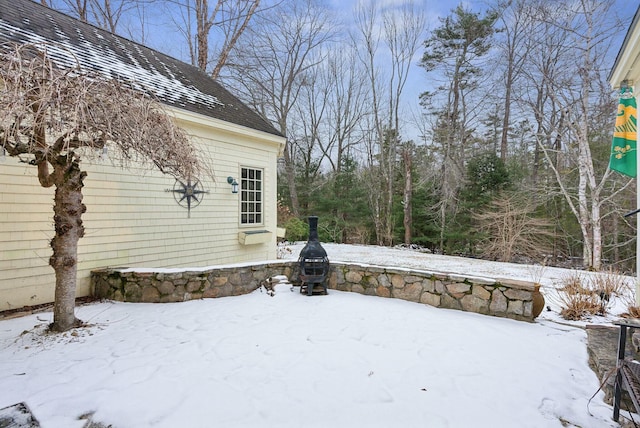 view of yard layered in snow