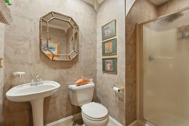 bathroom with toilet, walk in shower, and ornamental molding