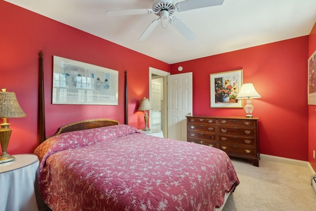 bedroom with ceiling fan and light colored carpet