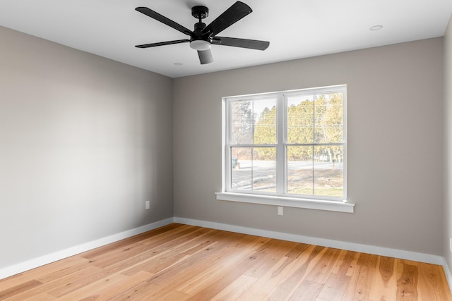 unfurnished room featuring light wood-type flooring and ceiling fan