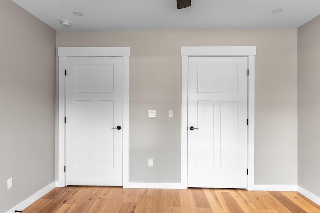 unfurnished bedroom with light wood-type flooring