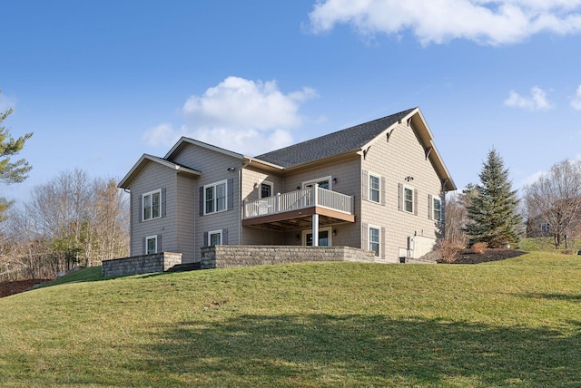 back of house featuring a yard and a deck