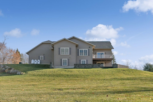 back of house featuring a yard and a wooden deck