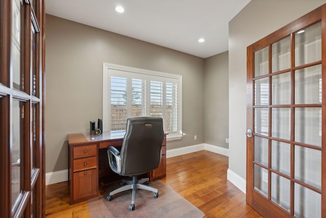 office with light hardwood / wood-style floors