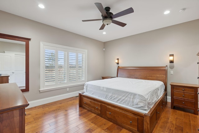 bedroom featuring ceiling fan and light hardwood / wood-style floors