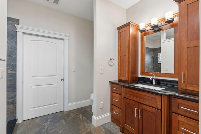 bathroom with vanity and toilet