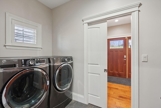 washroom with independent washer and dryer