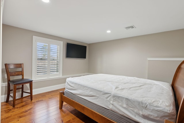 bedroom featuring wood-type flooring