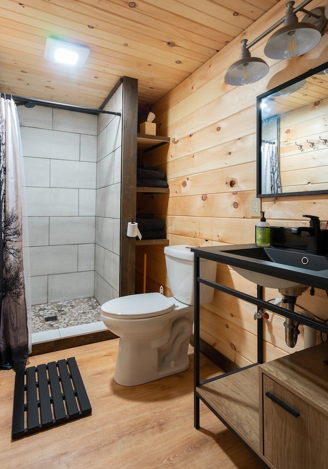 bathroom with wood walls, wooden ceiling, hardwood / wood-style flooring, toilet, and curtained shower