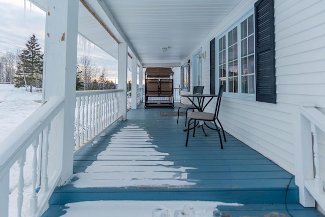 view of snow covered deck