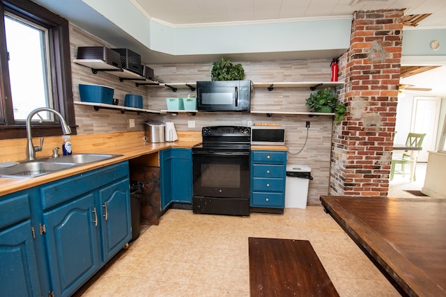 1153 Dexter Rd, Dover-Foxcroft, ME 04426 - kitchen featuring black appliances, blue cabinets, open shelves, ornamental molding, and wooden counters
