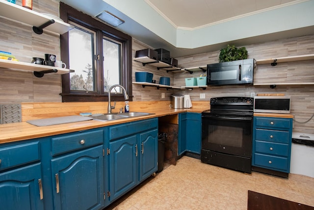 1153 Dexter Rd, Dover-Foxcroft, ME 04426 - kitchen with open shelves, black appliances, blue cabinets, crown molding, and wood counters
