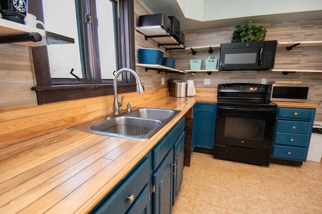 1153 Dexter Rd, Dover-Foxcroft, ME 04426 - kitchen with blue cabinetry, black appliances, and open shelves