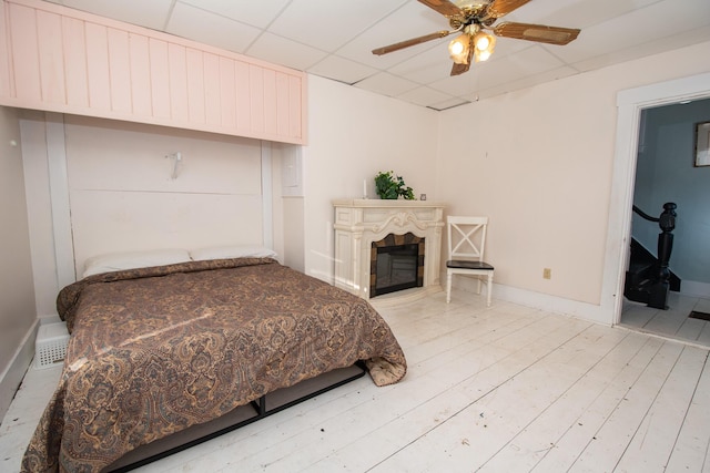 1153 Dexter Rd, Dover-Foxcroft, ME 04426 - bedroom with a fireplace and ceiling fan