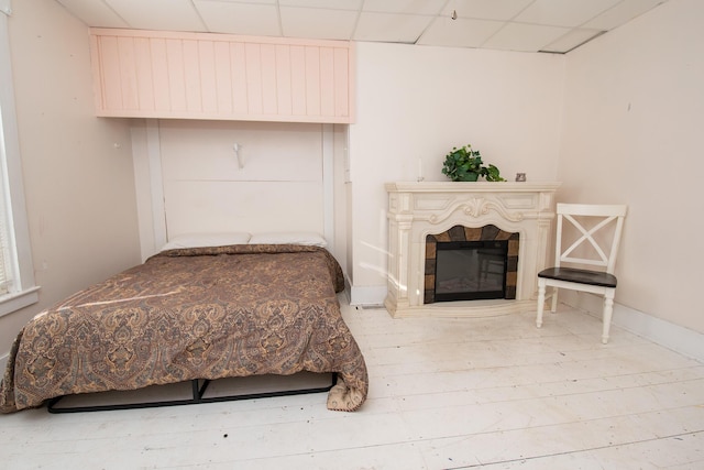 1153 Dexter Rd, Dover-Foxcroft, ME 04426 - bedroom featuring a glass covered fireplace and a drop ceiling