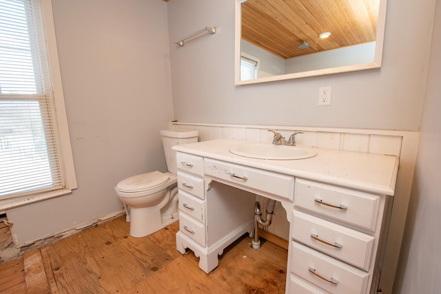 1153 Dexter Rd, Dover-Foxcroft, ME 04426 - bathroom featuring wood ceiling, vanity, and wood finished floors
