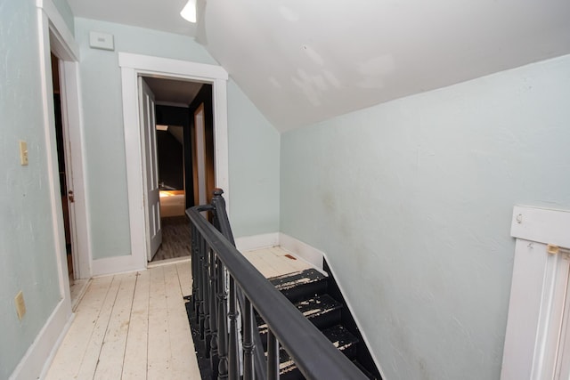 1153 Dexter Rd, Dover-Foxcroft, ME 04426 - corridor with an upstairs landing, light wood-style flooring, and lofted ceiling