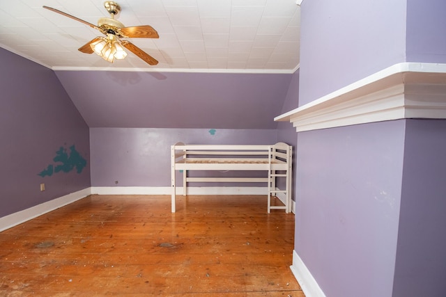 1153 Dexter Rd, Dover-Foxcroft, ME 04426 - additional living space with vaulted ceiling, a ceiling fan, and hardwood / wood-style floors