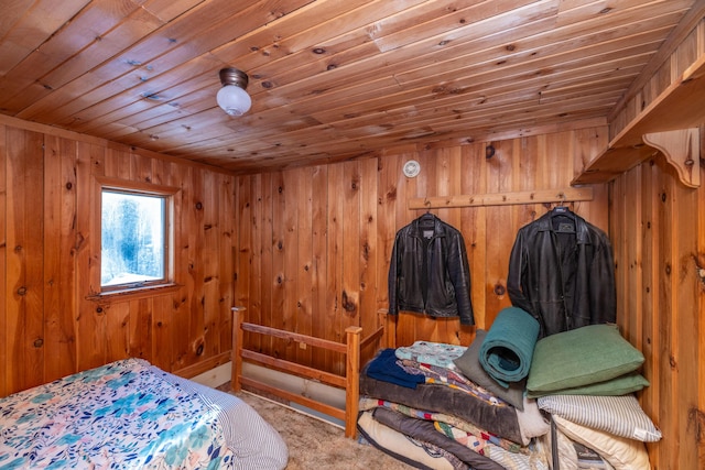 carpeted bedroom with wood ceiling