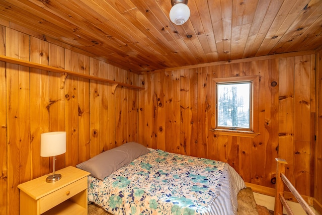 bedroom with wood walls