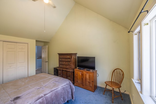 carpeted bedroom with ceiling fan, a closet, and lofted ceiling