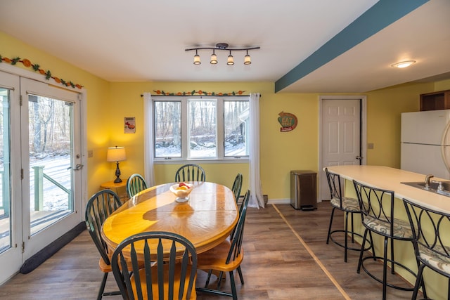 dining area with dark wood-type flooring