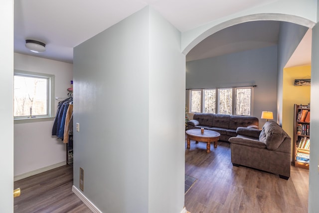 hallway with hardwood / wood-style flooring