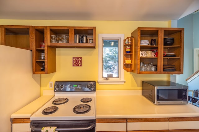 kitchen featuring white range with electric cooktop