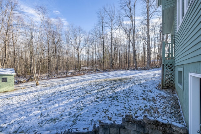 view of yard layered in snow