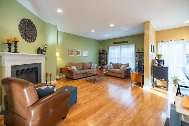 living room with light hardwood / wood-style flooring