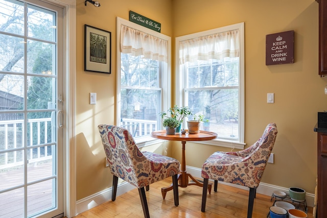 dining area with hardwood / wood-style floors