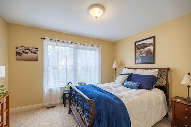 bedroom featuring light colored carpet