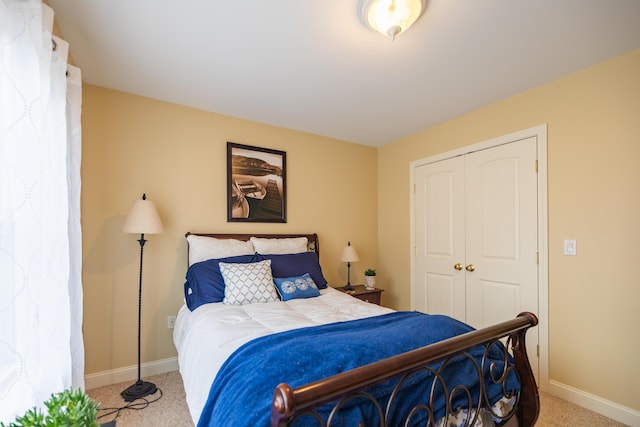 bedroom featuring a closet and carpet