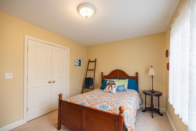 carpeted bedroom featuring a closet