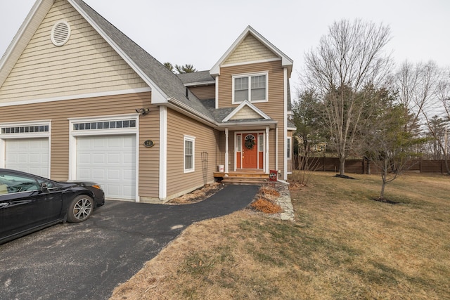 view of front of house featuring a garage and a front yard