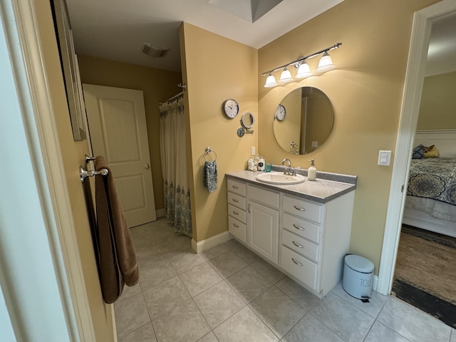 bathroom featuring vanity and tile patterned flooring