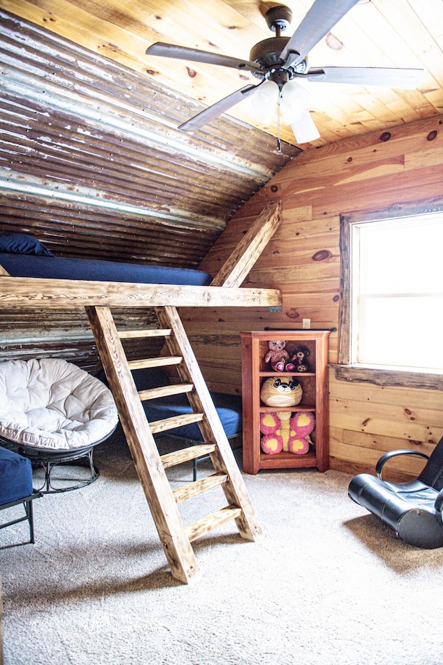 154 Old Brownville Rd, Sebec, ME 04481 - bedroom with wood walls, carpet flooring, and wood ceiling