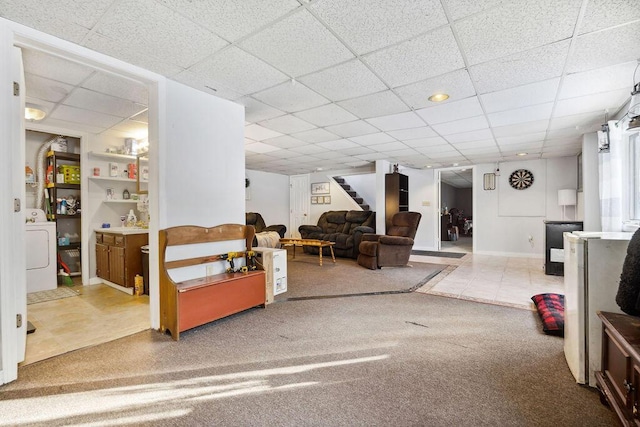 interior space with washer / clothes dryer and stairs