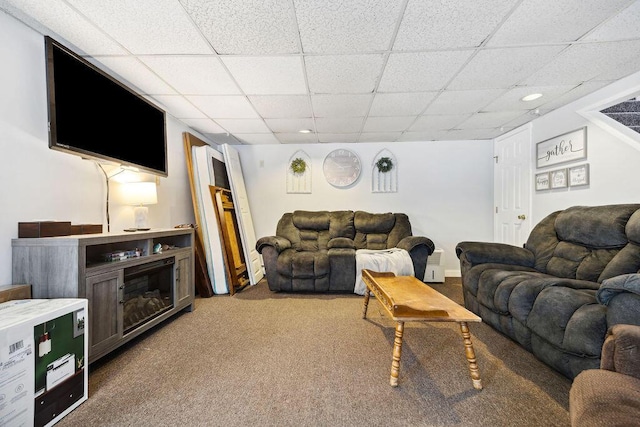 carpeted living room featuring a paneled ceiling