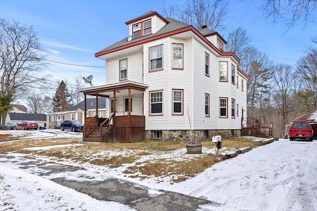 victorian-style house with a porch