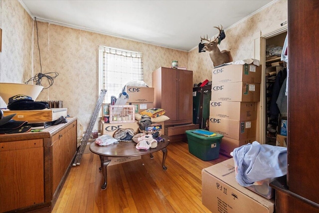 misc room featuring light hardwood / wood-style floors and crown molding