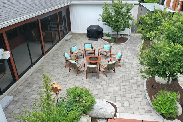 view of patio / terrace with a grill and a fire pit