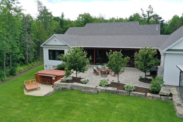 rear view of property featuring exterior bar and a patio area